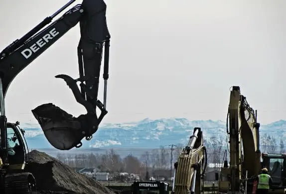 Excavator hits power line, causes fire