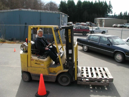 What are the three pedals on the forklift for?